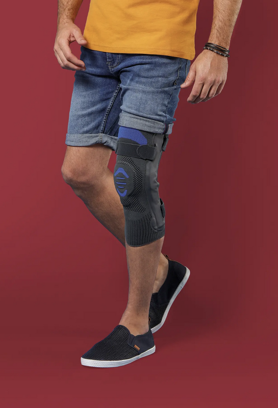 Knee brace with lateral hinged reinforcement Genu Dynastab Thuasne