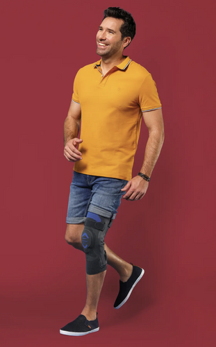 Knee brace with lateral hinged reinforcement Genu Dynastab Thuasne